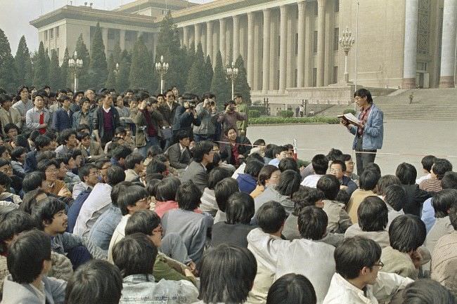 In this April 18, 1989 file photo, a Chinese student leader reads a list of demands to students staging a sit-in in front of Beijing’s Great Hall of the People.