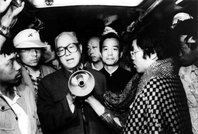 Communist Party General Secretary Zhao Ziyang speaks with fasting university students in Beijing’s Tiananmen Square to urge them to call off their hunger strike. The strike is in its sixth day.