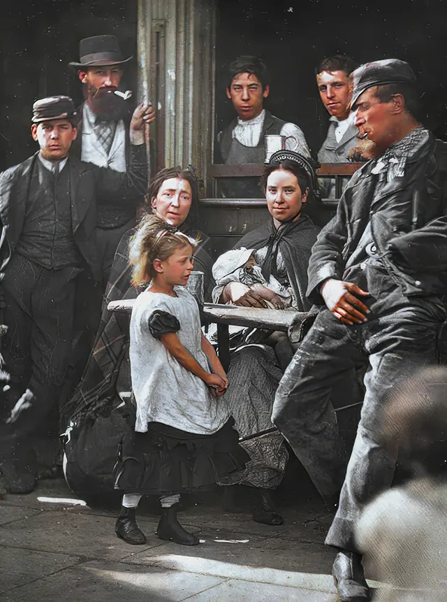 A young girl named Hookey Alf waits outside a London pub, 1890s.