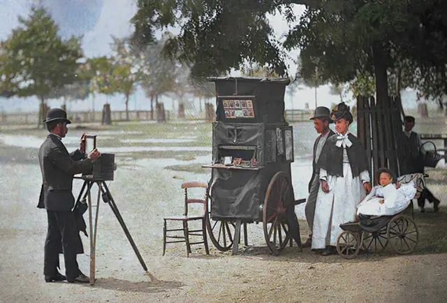 A street photographer snaps a family photo at Clapham Common, 1890s.