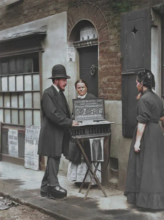 A street doctor sells new cough drops, 1890s.