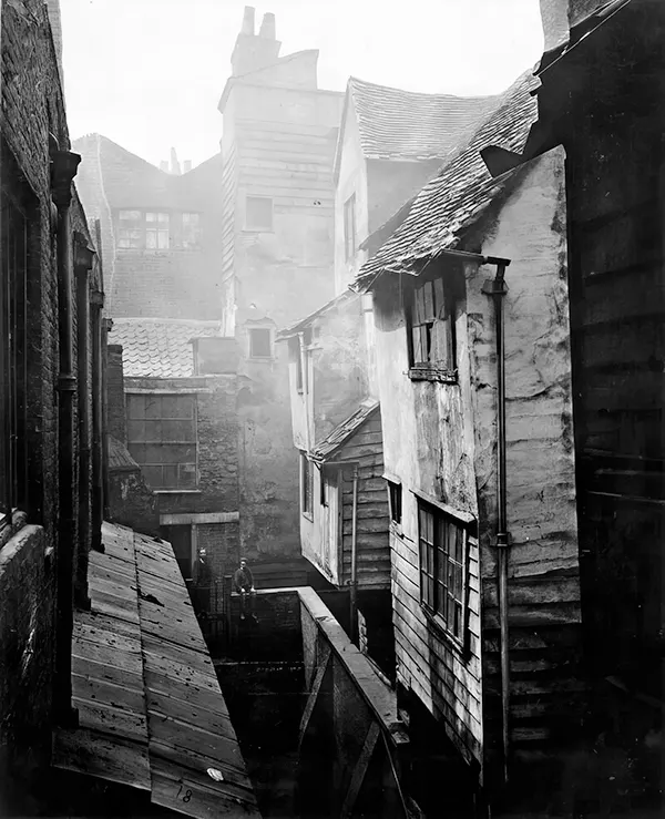 While some of London’s slums were hastily erected shantytowns, other slums were made of centuries-old houses. This photograph from 1877 shows homes in Cloth Fair built after the Great Fire of London in the 17th century.