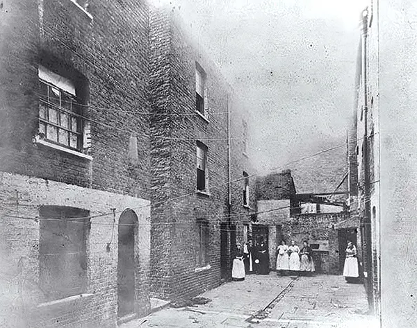 Residents at Boundary Street, located in the Old Nichols slum.