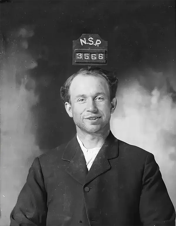 George Ray’s 1890s mugshot is rare in that the prisoner is smiling.