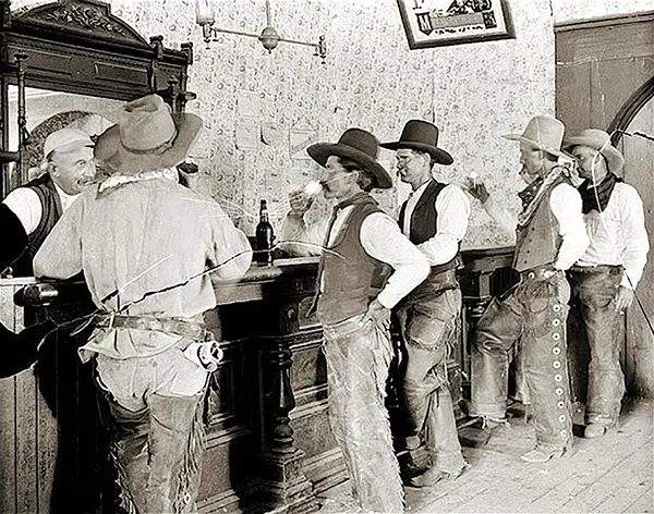 Cowboys enjoy drinks at the Equity Bar in Old Tascosa, Texas, 1907.