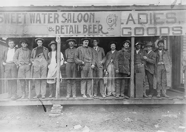 Men gather outside the Sweetwater Saloon in Texas.