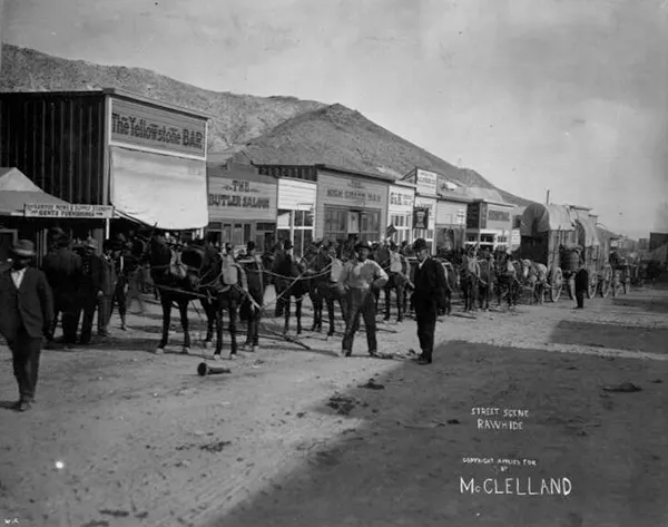 Saloons and wagons line the streets of this frontier town.