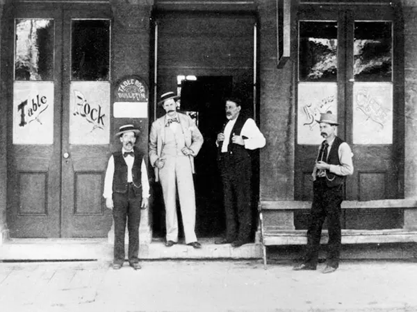 Men standing in front of a saloon called “Table Rock”, 1890s.