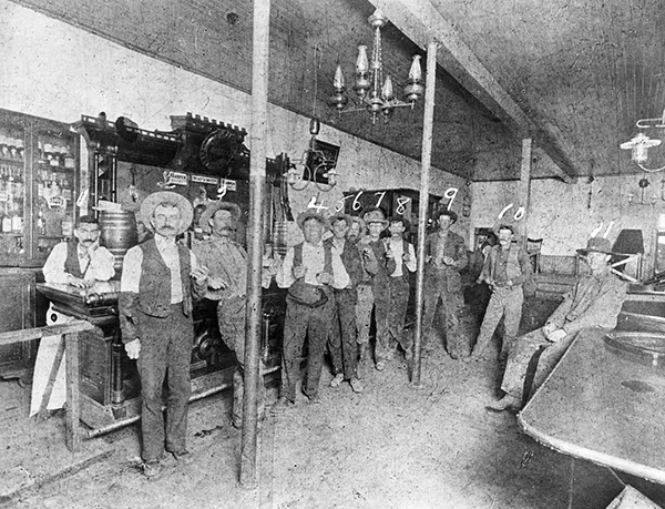 Members of the notorious Hash Knife Cowboys pose for a picture at the Fashion Saloon in Winslow, north eastern Arizona. The cowboys were initially hired to help the Aztec Land & Cattle Company look after the more than 33,000 cattle they had acquired. However, the outfit soon gained an unsavory reputation.