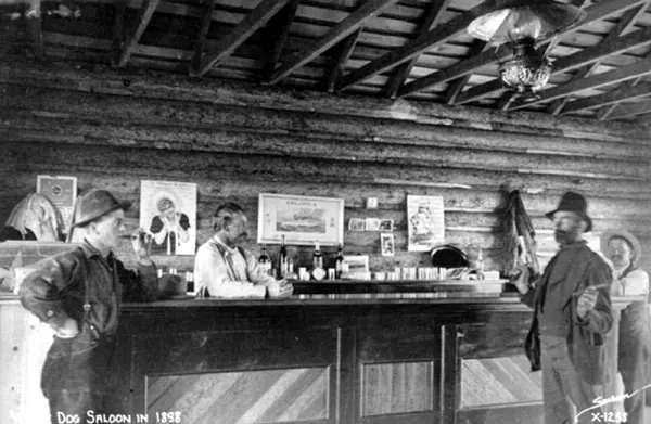 A man pulls a gun at the White Dog Saloon in Fort Worth, Texas, in 1898.