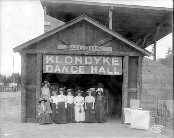 Women outside of the Klondyke Dance Hall and Saloon in Seattle, Washington, 1909.