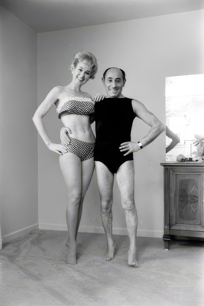 Alfred Eisenstaedt poses with "beauty culturist" and the first woman to star in her own daily exercise TV show, Debbie Drake, 1962.