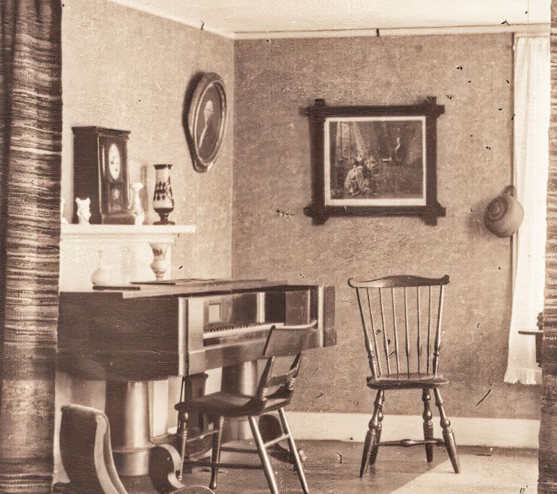 Looking at the 1824 Geib piano in the "pink room", or front east room, of the Allis-Bushnell House, 1924