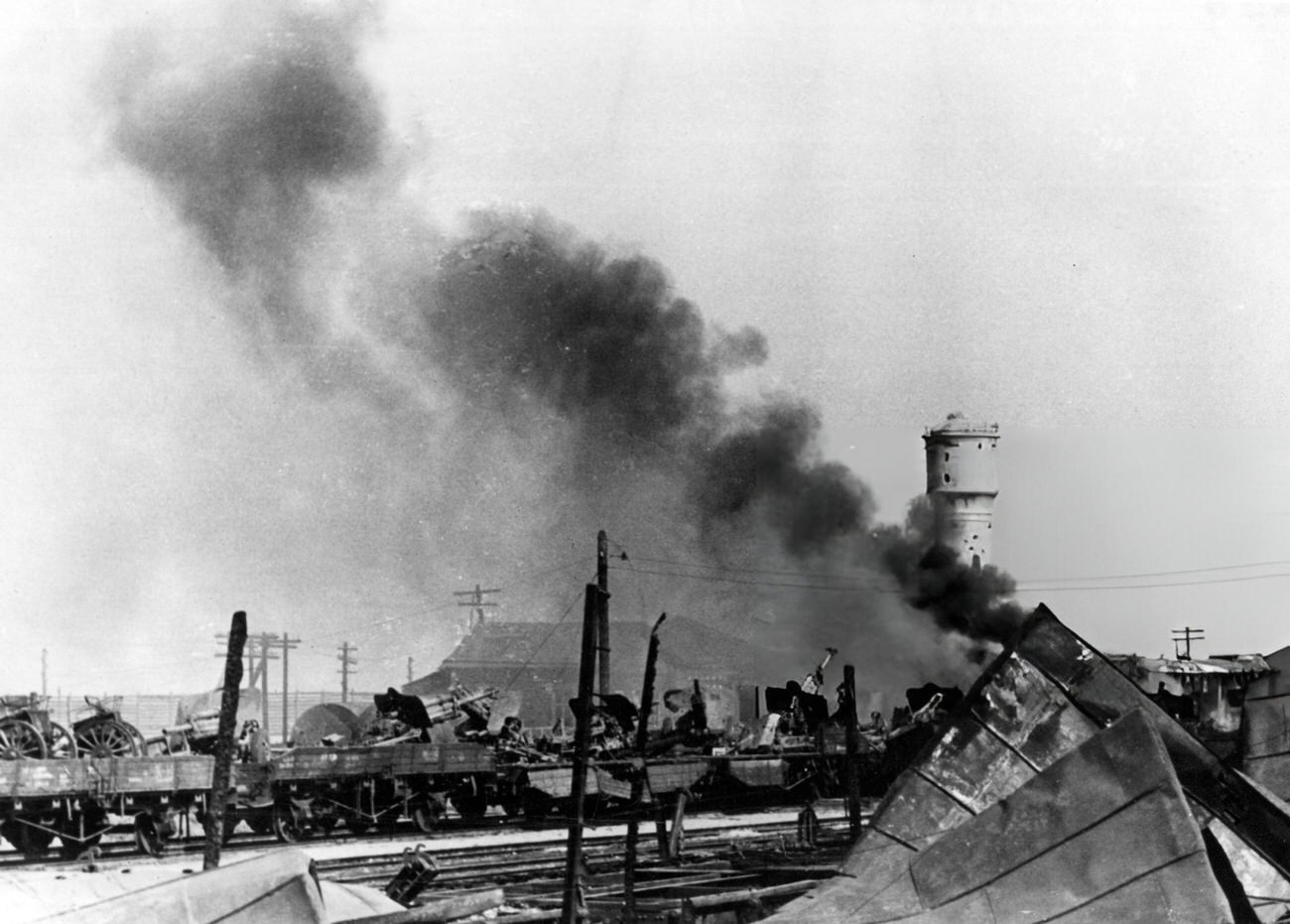 Train loaded with Russian artillery in a station on fire in Stalingrad, 1942.