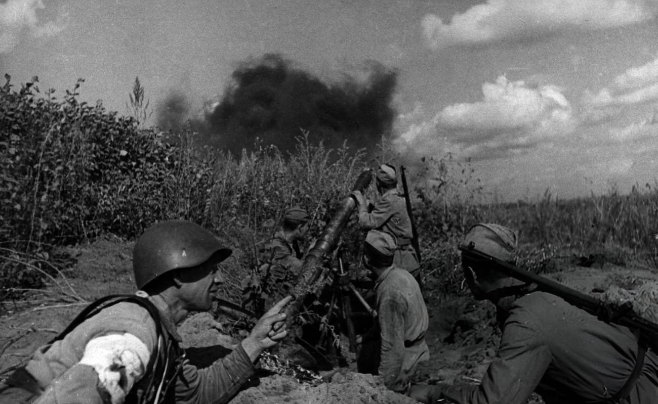 Soviet Soldiers Firing Mortar from Trench.