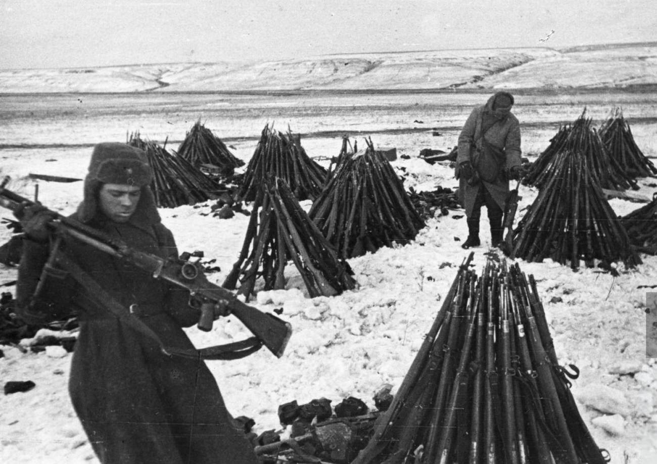 Soviet soldiers counting the captured rifles, 1943.