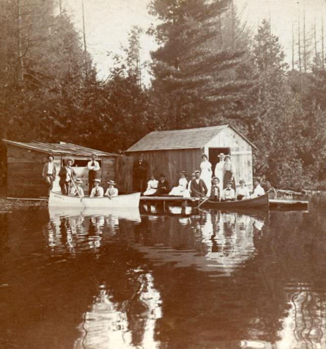 Canoes at the boathouse on the lake, possibly from the Muskokas or Lake Simcoe