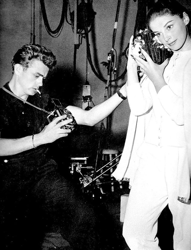 James Dean taking a photograph of Anna Maria Pierangeli with a Rolleiflex