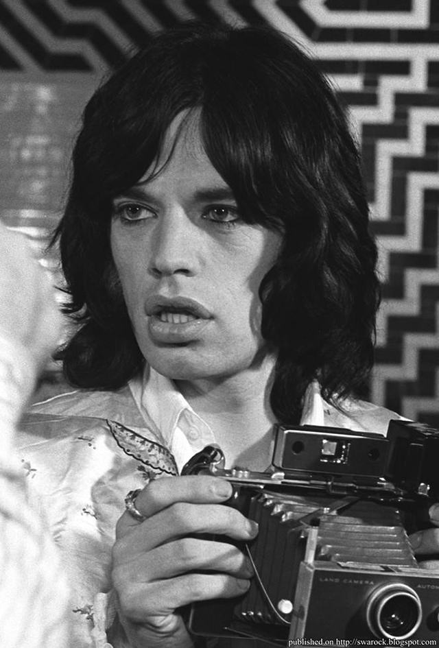 Mick Jagger with a Polaroid