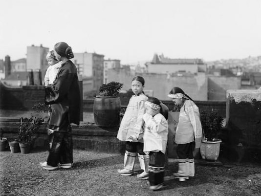 These girls seem to have had the fortune of being born into a non-foot binding tradition. The Manchu people were among those who historically eschewed the practice; in fact, their Emperor forbade it when they came to power in 1644.