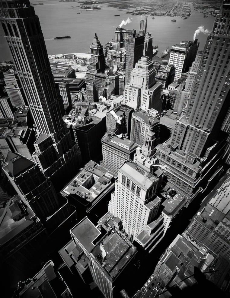 Birds-eye view of Lower Manhattan looking southeast towards Battery Park with Ellis Island beyond and the New Jersey waterfront in the distance, 1945.