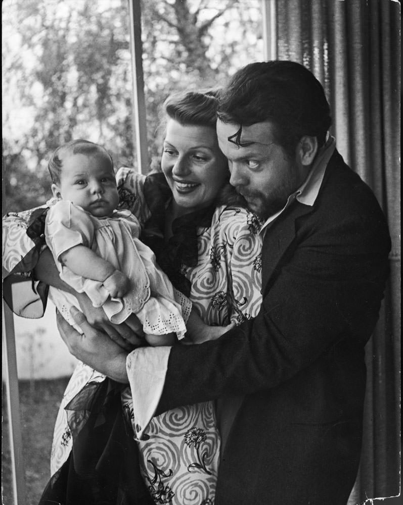 Orson Welles with his wife Rita Hayworth and daughter Rebecca, 1945.