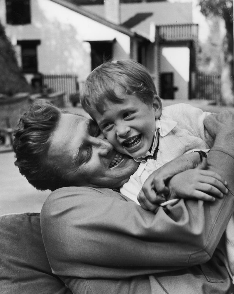 Kirk Douglas hugs his son Michael, 1949.