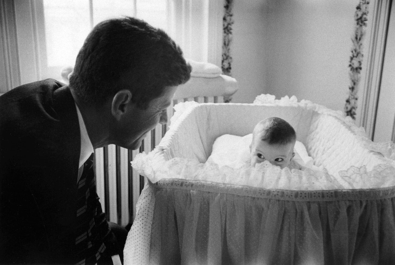 Senator John F. Kennedy with daughter Caroline, 1958.