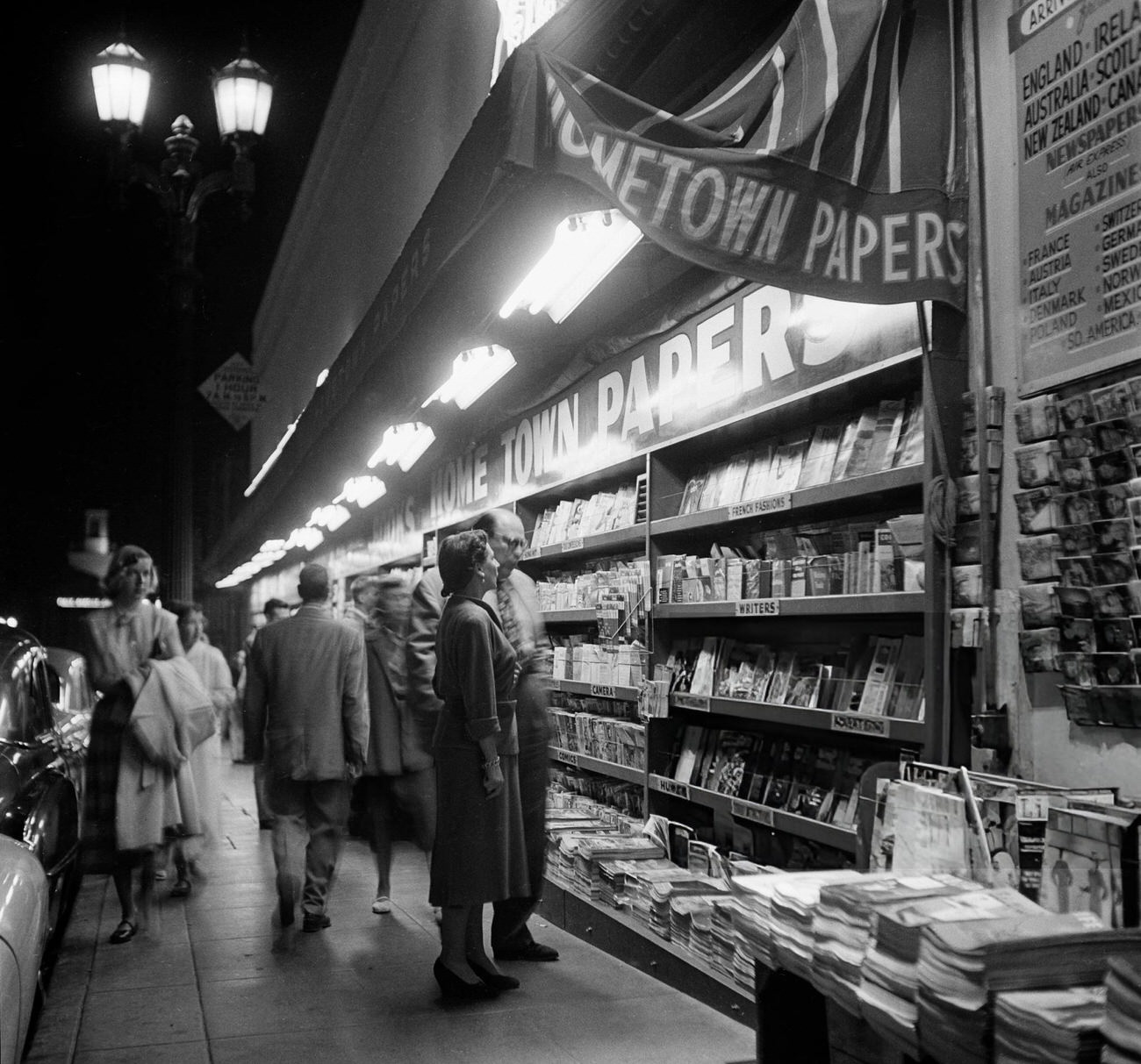 People gathered around the local newsstand on Hollywood Boulevard in Hollywood, California, 1951.