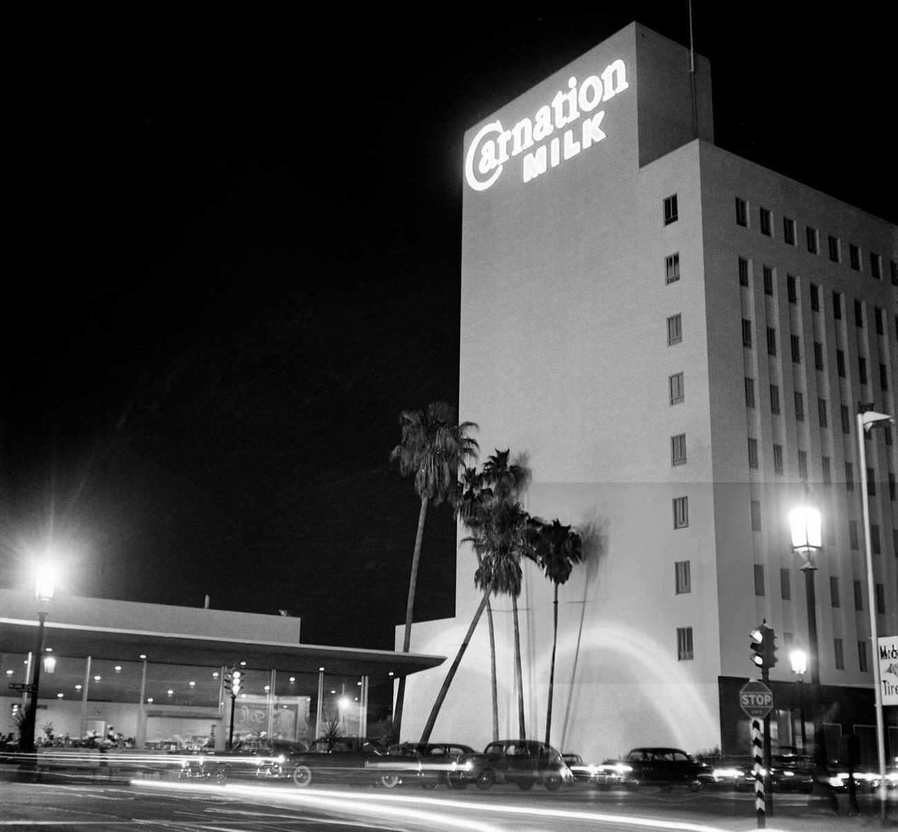 Cars driving past the Carnation Milk building on Hollywood Boulevard in Hollywood, California, 1951.