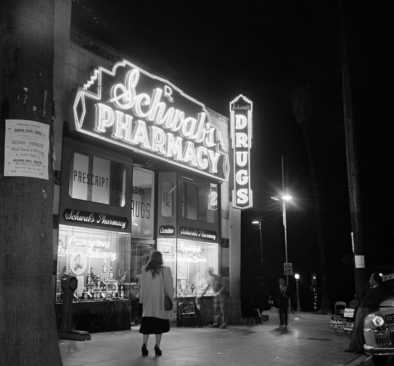 A woman walking to Schwab's Pharmacy on Hollywood Boulevard in Hollywood, California, 1951.