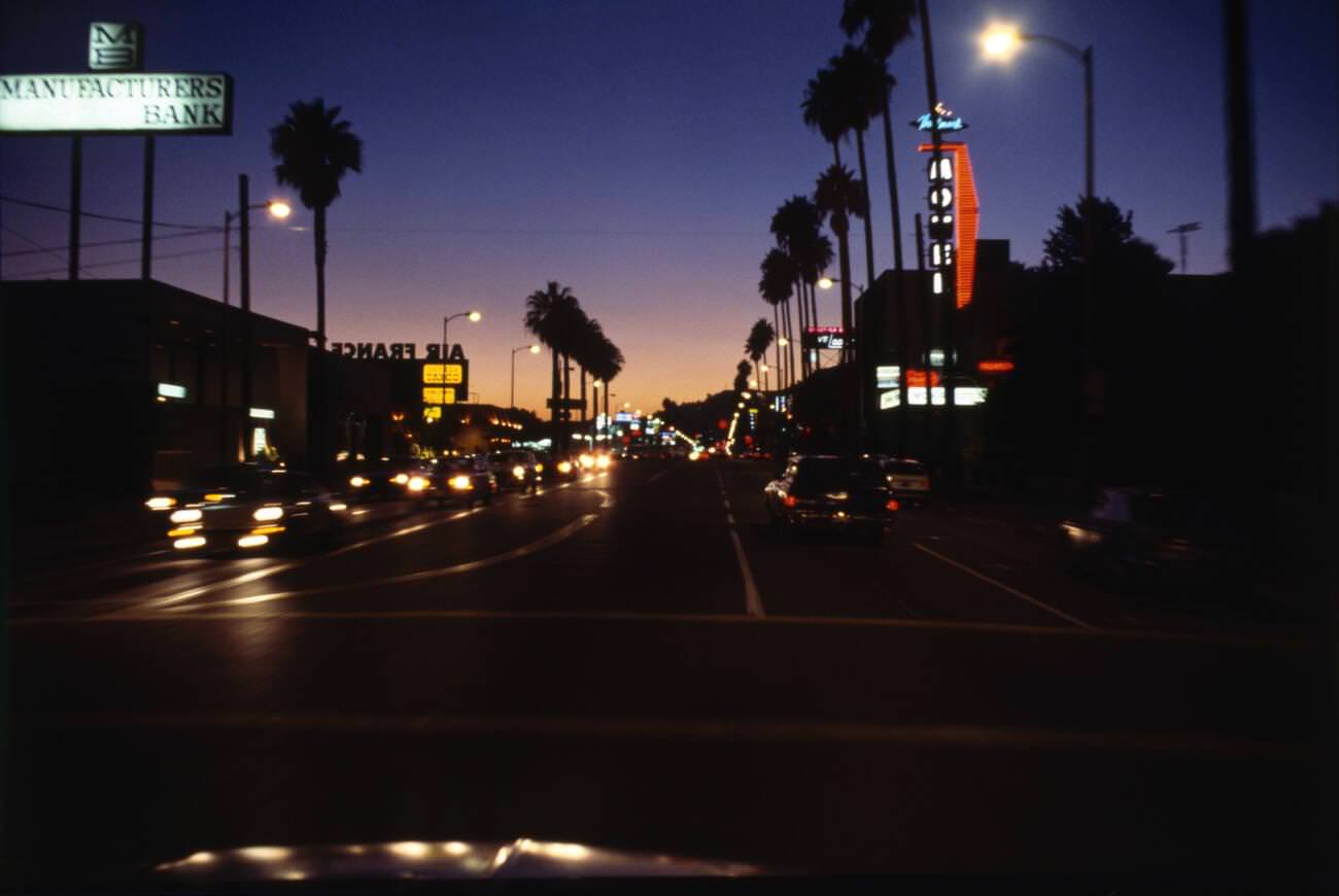 Sunset Boulevard at dusk, driving west into a clear sky.