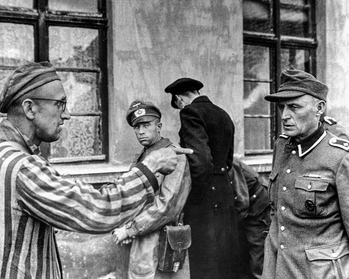 A Jewish Russian survivor liberated in 1945 by the U.S. Army at the notorious Buchenwald concentration camp in Germany confronts and identifies a former guard from the Nazi SS, 1945.