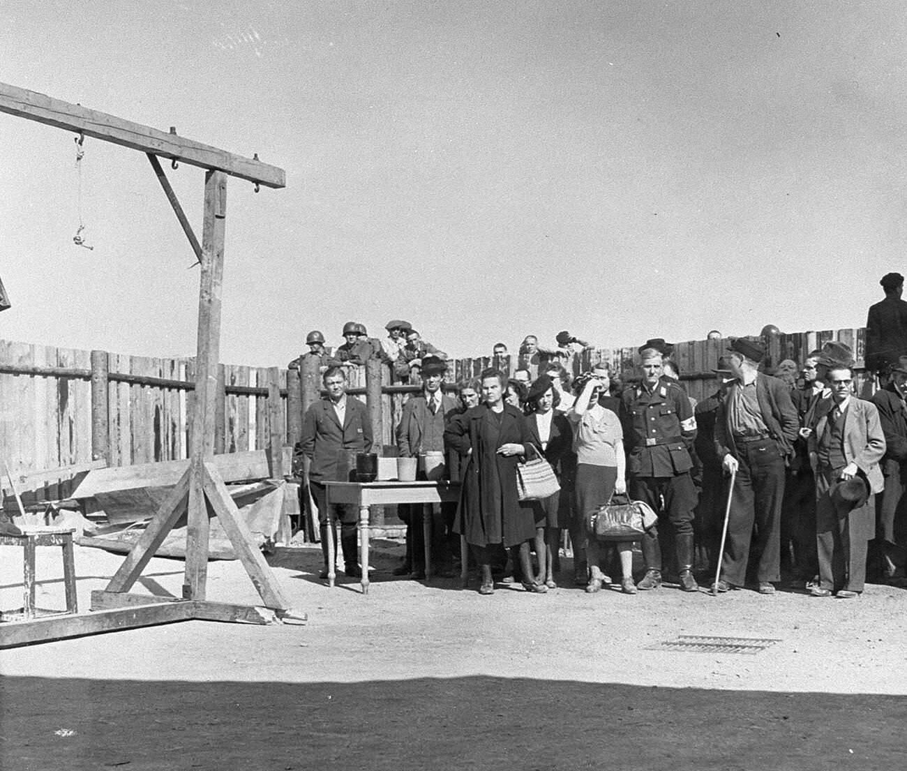 A Red Cross delegation touring Buchenwald concentration camp after its liberation. , 1945.