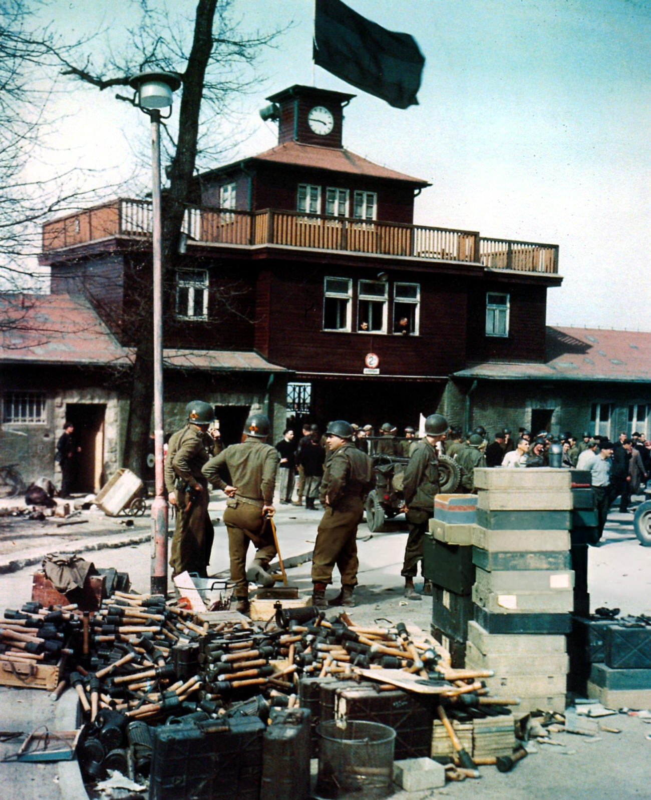 Members of the US 5th Ranger Infantry Battalion outside the newly-liberated Buchenwald Concentration Camp, 1945.