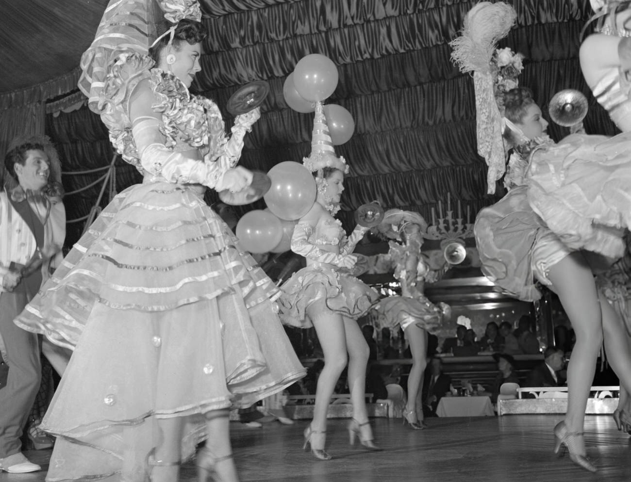 A Dance Ensemble Entertains Guests at a Masquerade in the Latin Quarter of New Orleans, 1940s.