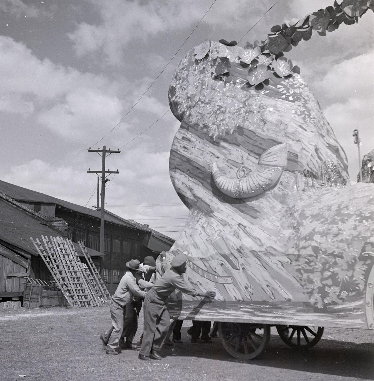 A Group of Men Store a Mardi Gras Float in a Warehouse, 1950s.