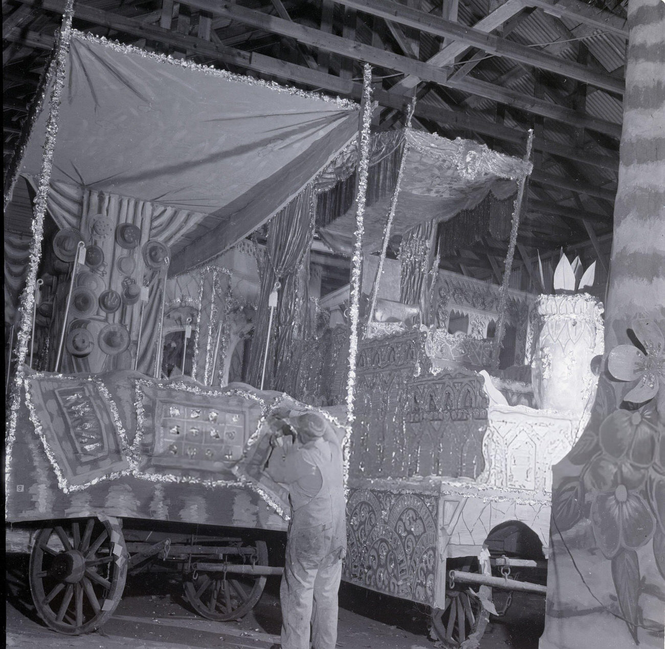 A Man Puts the Finishing Touches on a Mardi Gras Parade Float, 1950s.