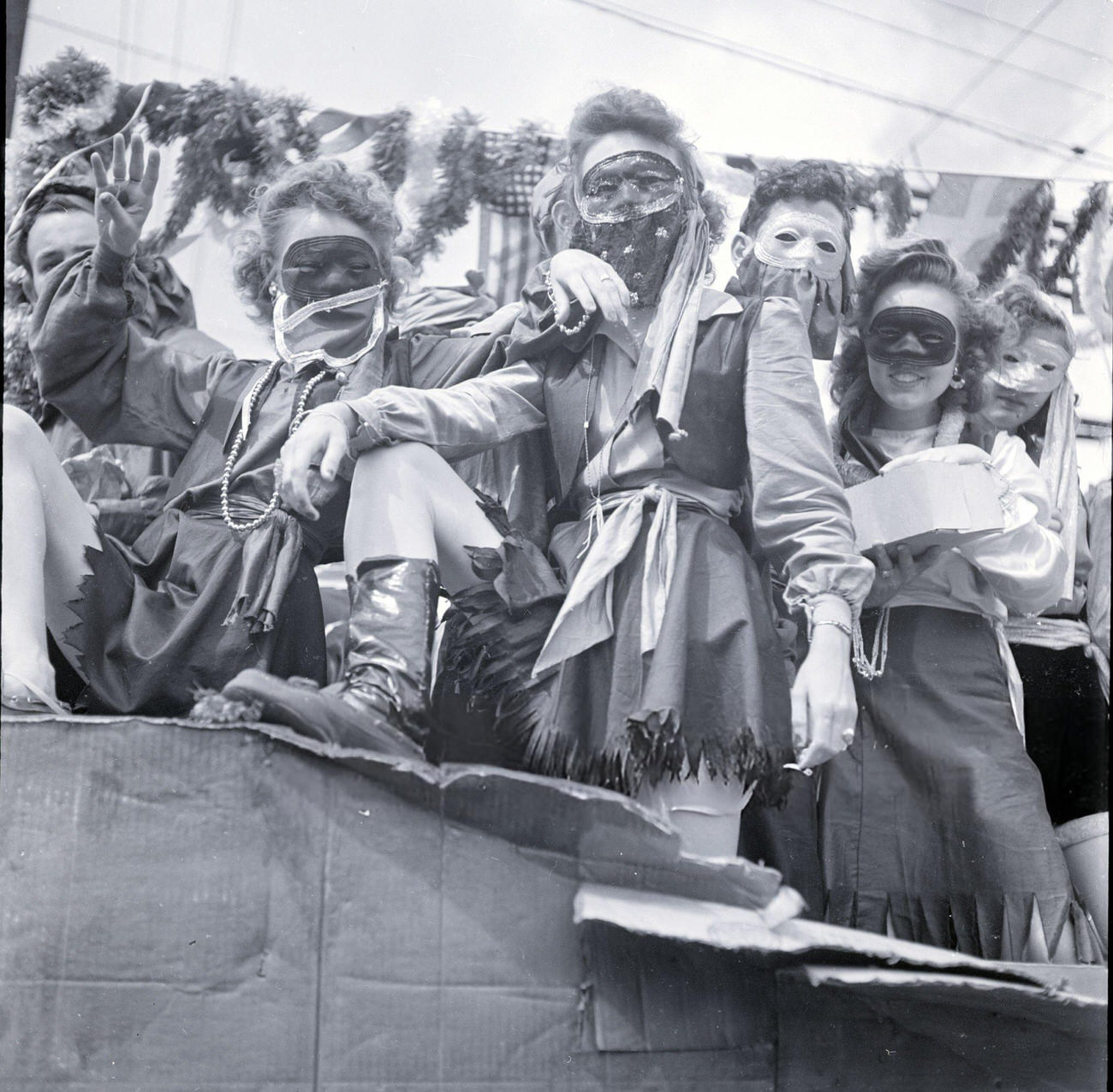 Veiled, Masked Women on a Mardi Gras Float Truck During a Mardi Gras Parade, 1950s.