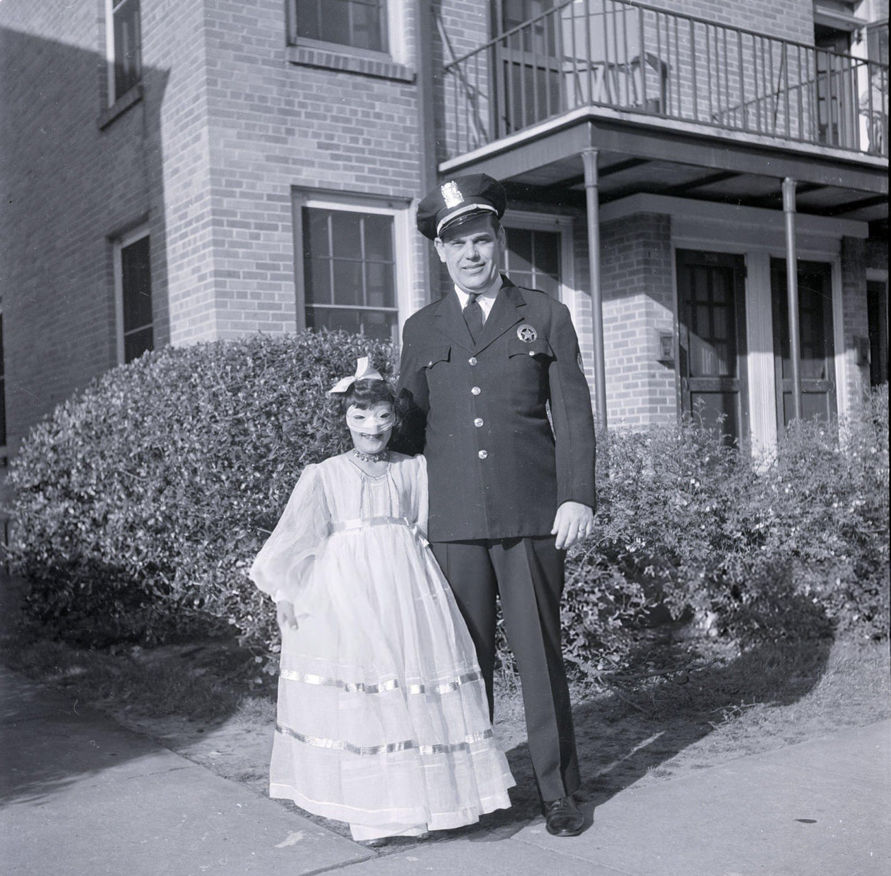 A Father and Daughter Before Departing for Mardi Gras Festivities, 1950s.