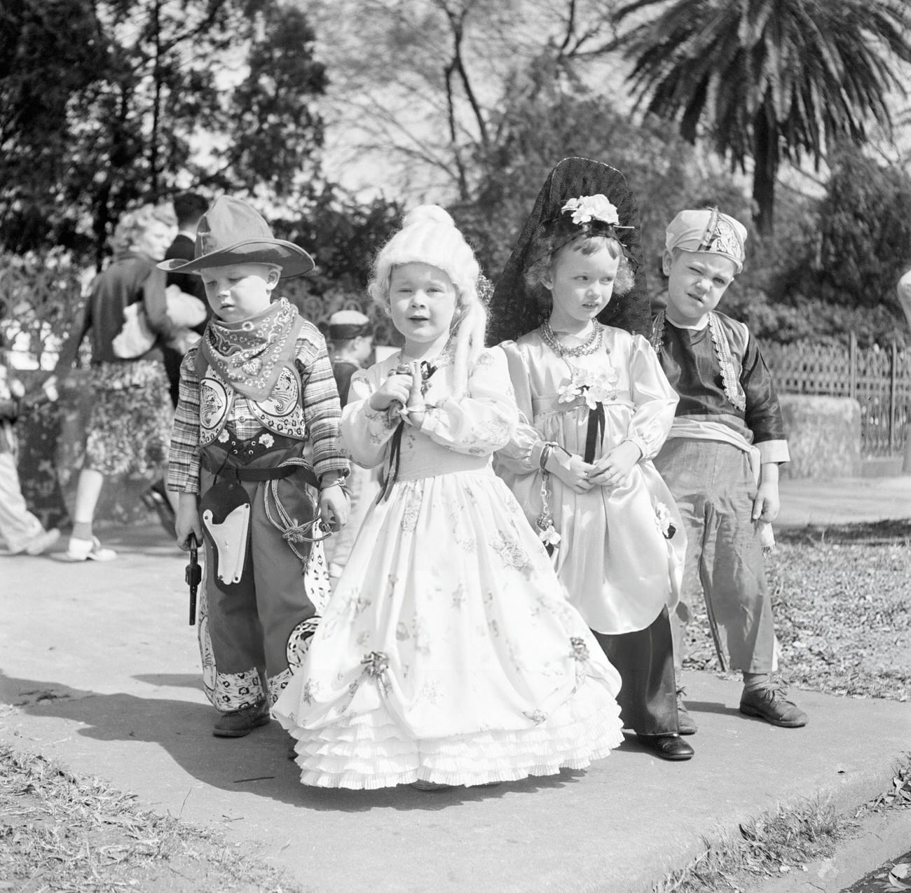 A Group of Boys and Girls Dressed Up as Pirates, Cowboys, and Princesses for Mardi Gras, 1950s.