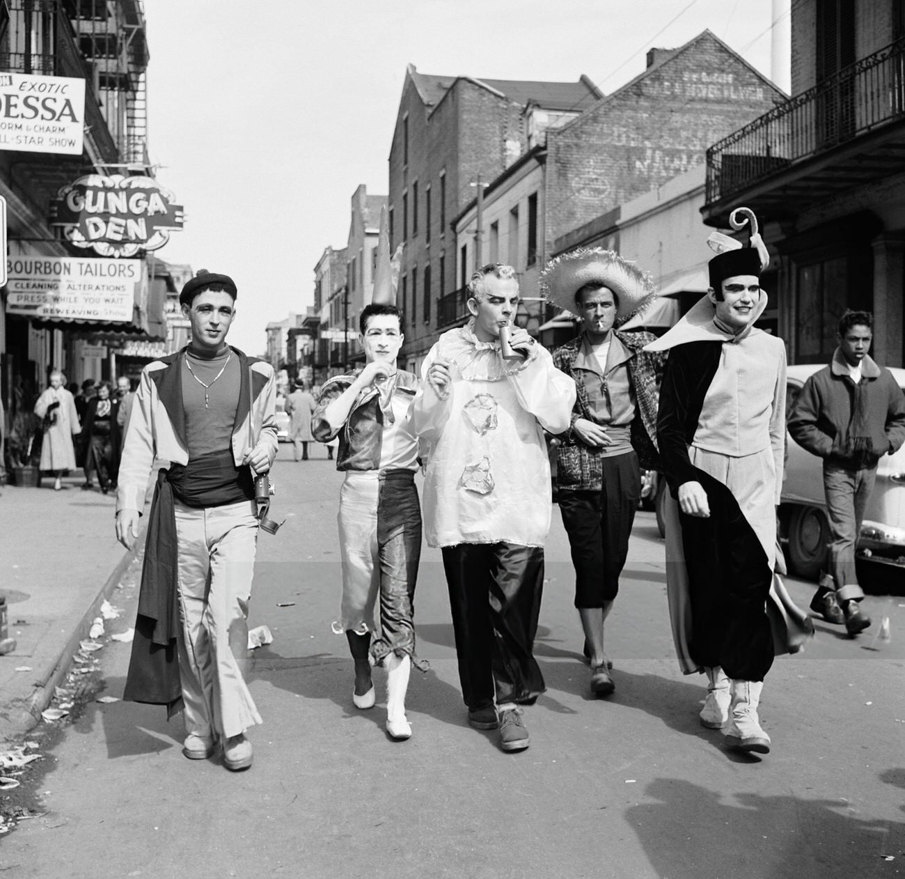 Costumed Figures Walk Down Bourbon Street During Mardi Gras, 1950s.