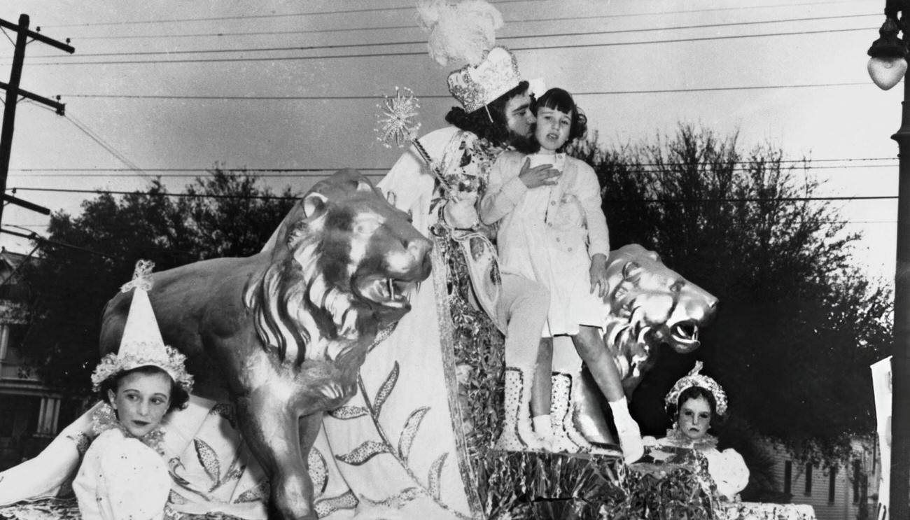 King Mid-City XV Kisses Valerie Combe After Receiving the Keys to New Orleans From the Six-Year-Old of the Sacred Heart Orphanage During Mardi Gras Week, 1952.