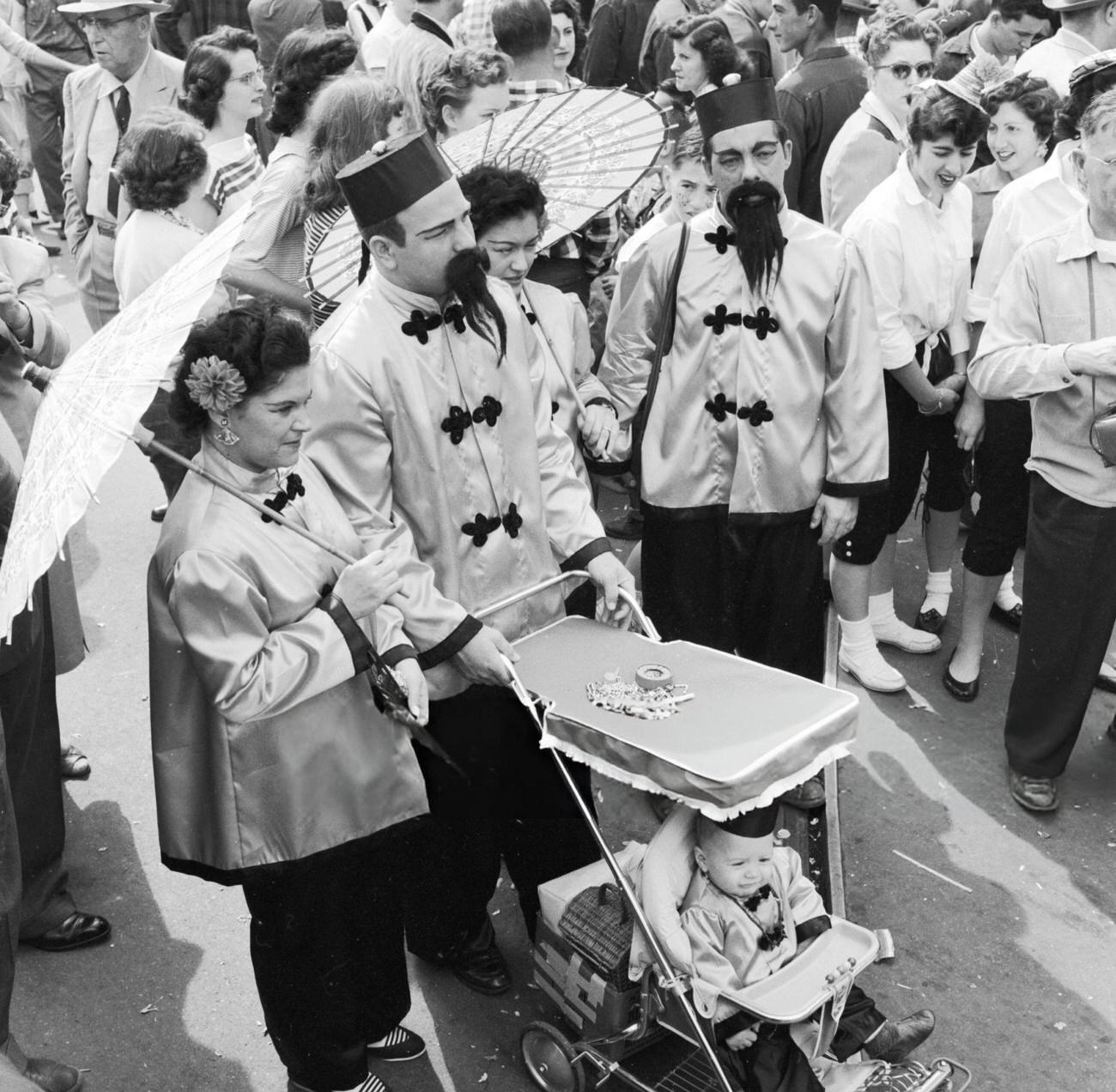 A Family in Fancy Dress Dressed Identically as Chinese Mandarins at the Mardi Gras, 1950s.