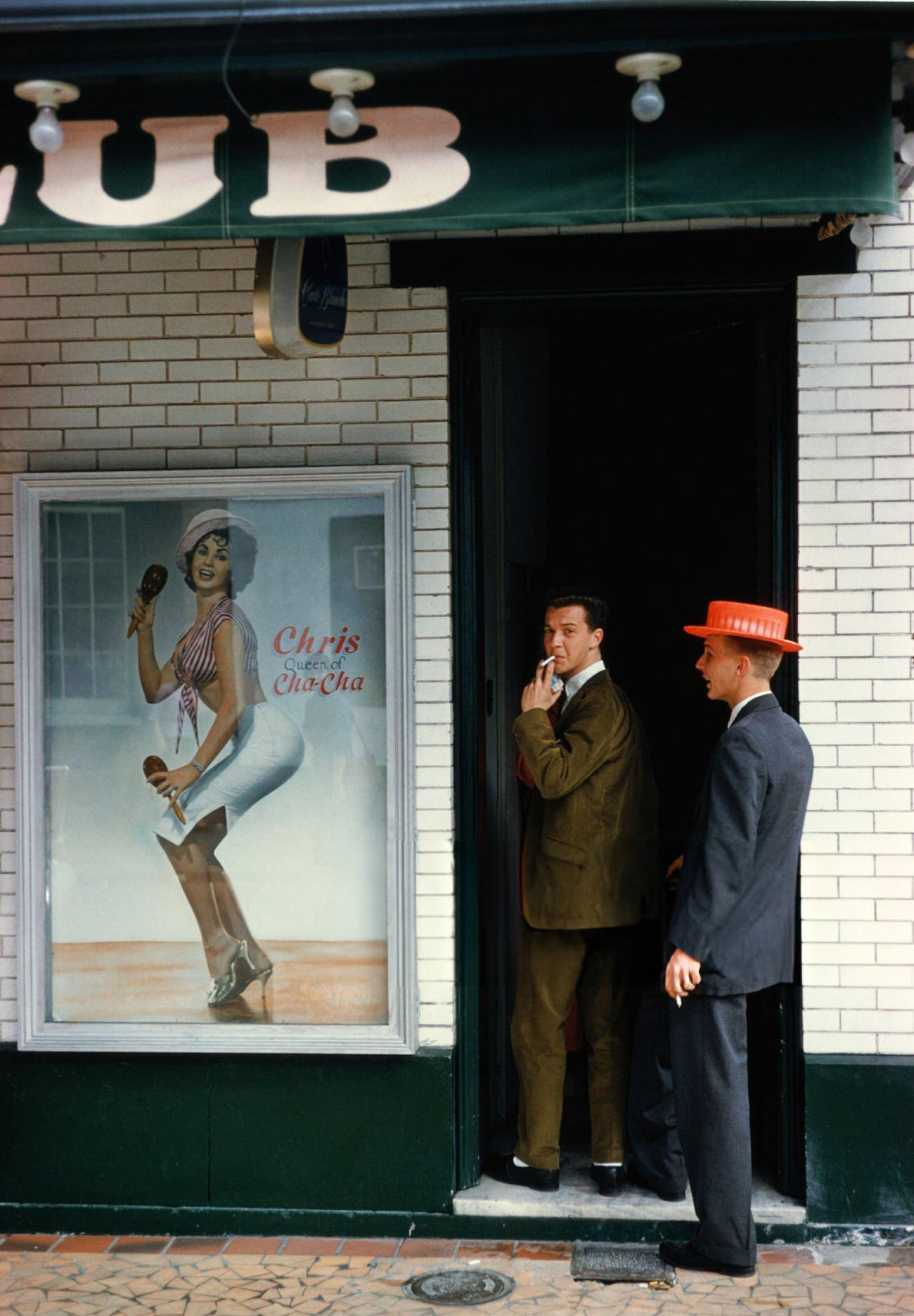 Two Men Enter a Club Which Advertises 'Chris Queen of the Cha-Cha' During Mardi Gras in New Orleans, 1961.