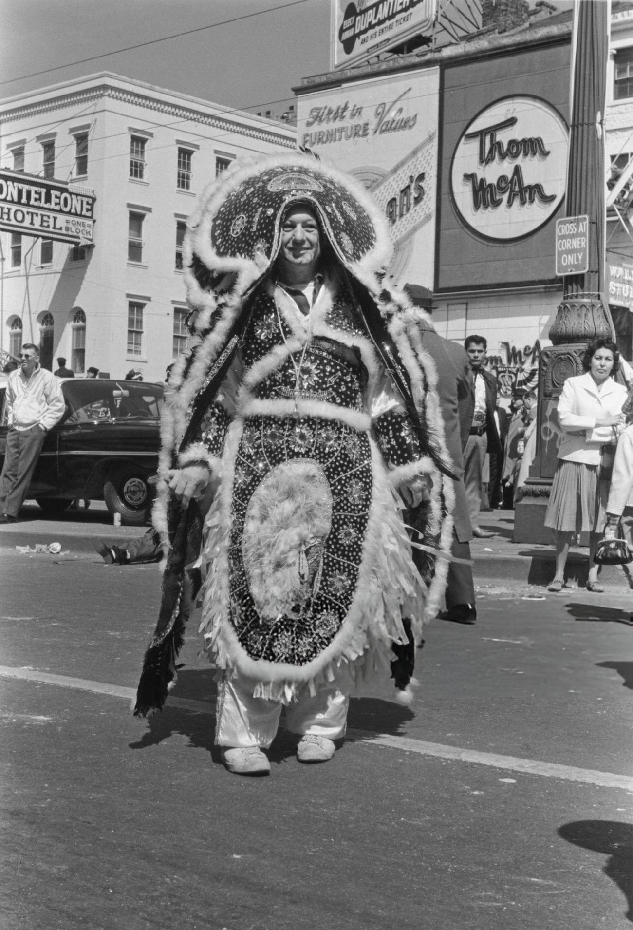 A Man in an Ornate Embroidered Costume on Canal Street During the Rex Parade, 1962.