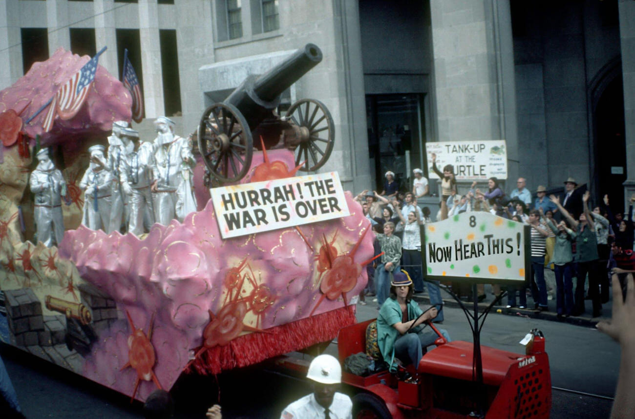 View of a Float That Carries a Cannon and a Sign Which Reads 'Hurrah! The War is Over' in the Mardi Gras Parade, 1973.