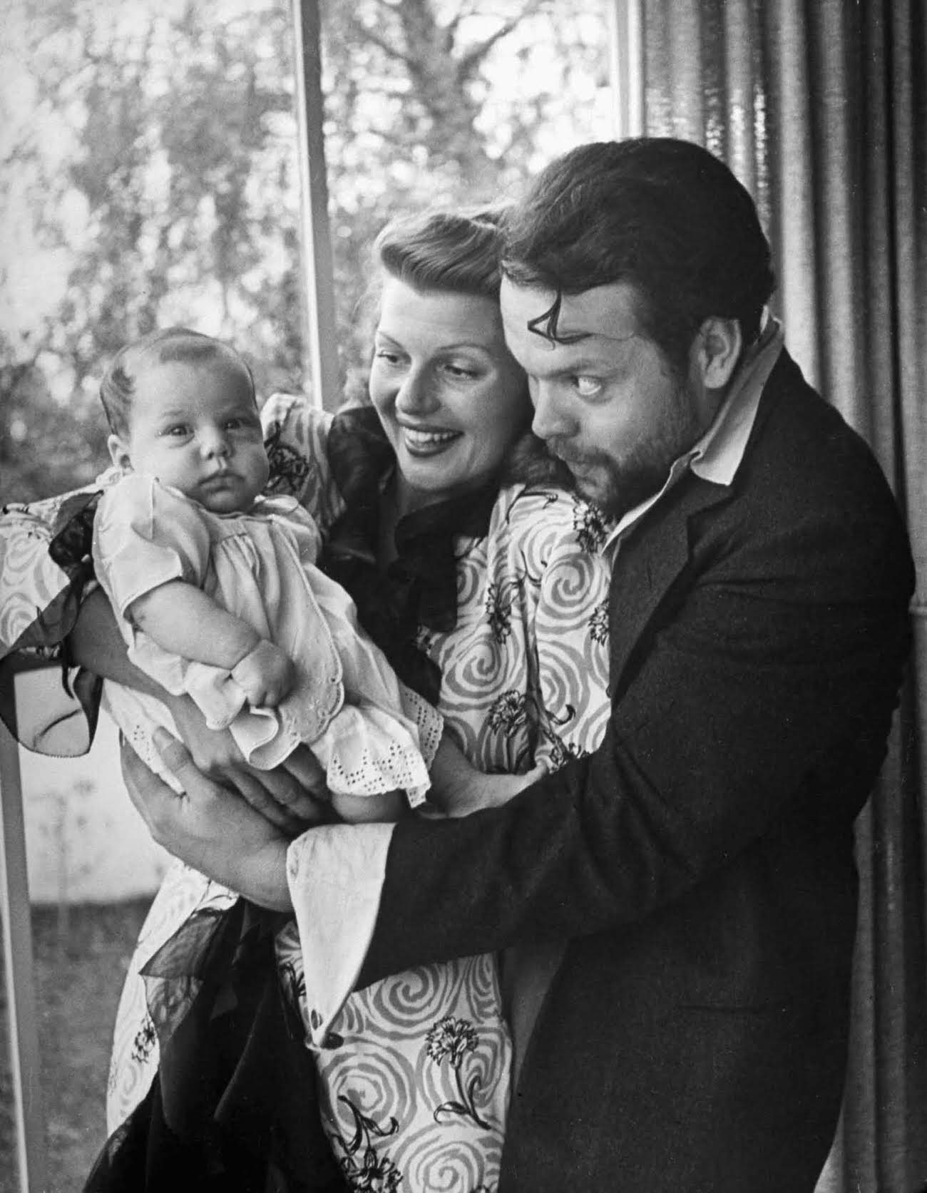 Rita Hayworth and Orson Welles with their daughter, Rebecca Welles, 1944.