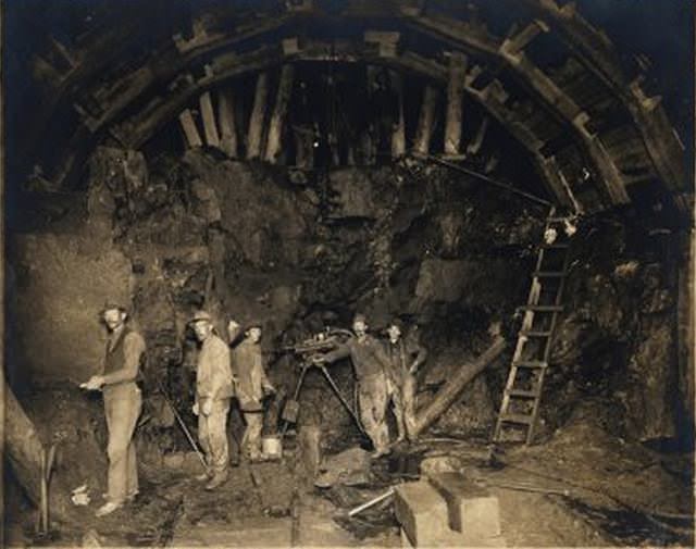 Subway tunnel under construction: laborers look at camera." No date given.