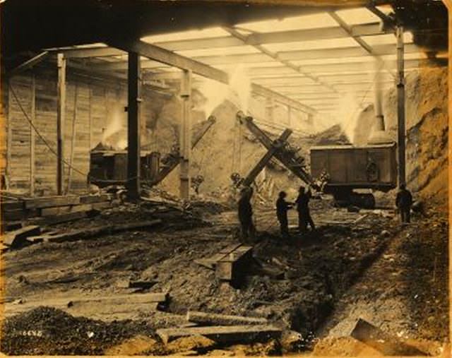 Independent Subway Construction: Interior of above structure. Workers and cranes. January 1931.